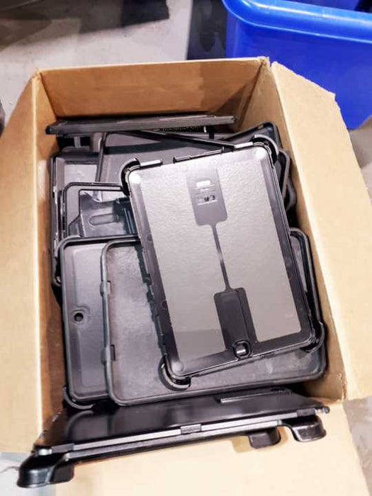 A box  of  assorted Otterbox EasyGrab Tablet Cases &