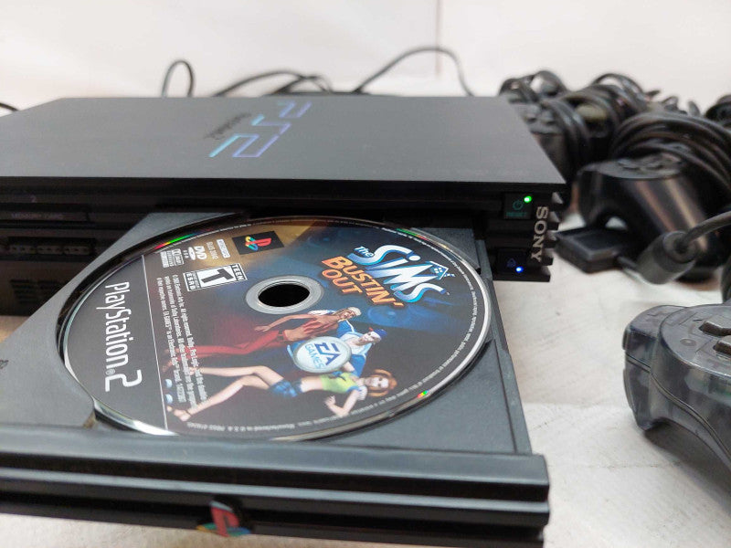 Sony Playstation 2 with 7 games, 6 controllers, 2 singstar microphones,cables