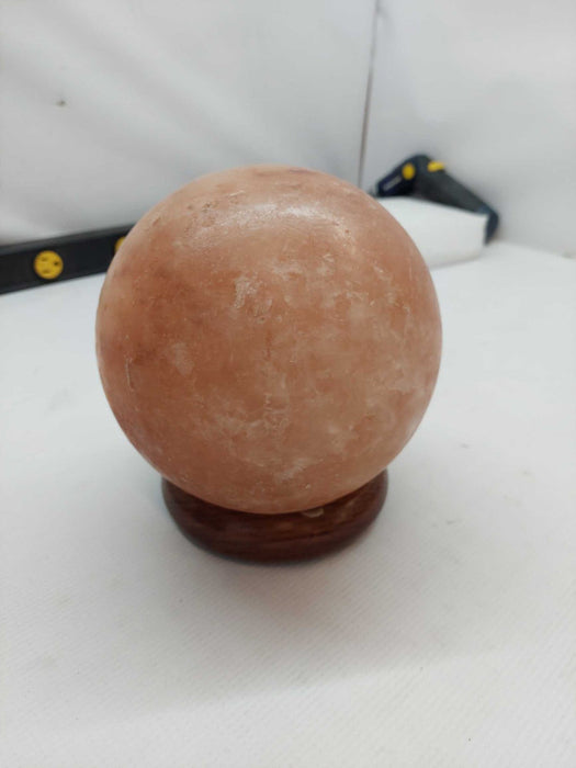 Polished Himilayan Salt Rock on wooden pedestal