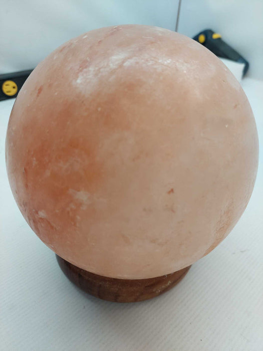 Polished Himilayan Salt Rock on wooden pedestal