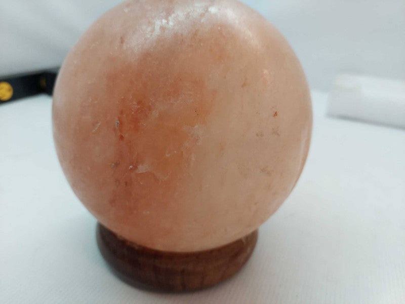 Polished Himilayan Salt Rock on wooden pedestal