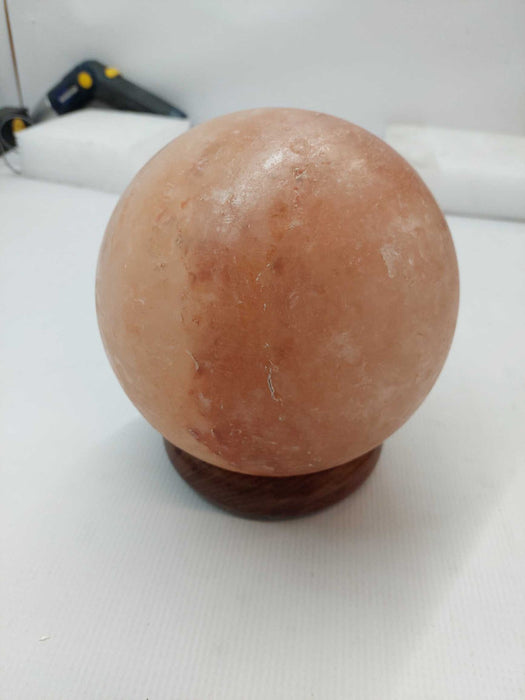 Polished Himilayan Salt Rock on wooden pedestal