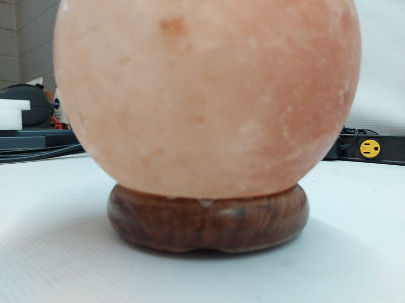 Polished Himilayan Salt Rock on wooden pedestal