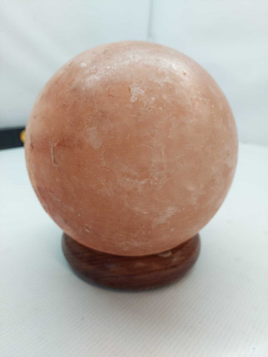 Polished Himilayan Salt Rock on wooden pedestal