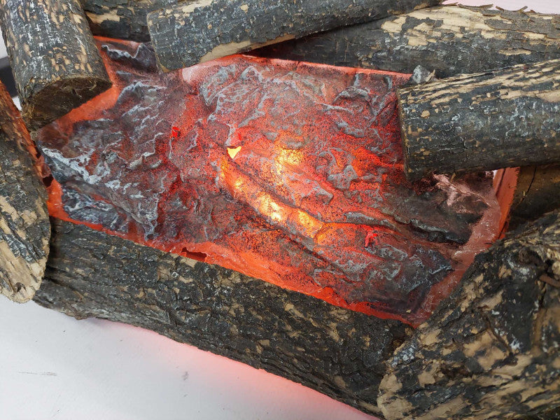 Logs Of Fire , Simulates a burning fire with a spinning fake log , electric