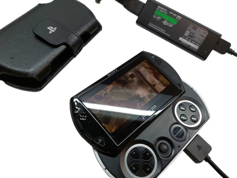Sony PSP GO PSP-N1001 with Sony Charging AC Adaptor PSP-N100  =