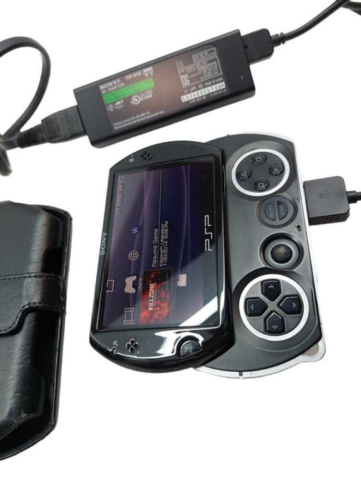 Sony PSP GO PSP-N1001 with Sony Charging AC Adaptor PSP-N100  =